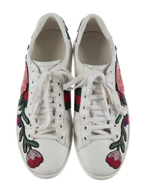 gucci embroidered ace sneakers.